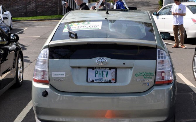 Good plate! PHEV = Plug In Hybrid Vehicle. 