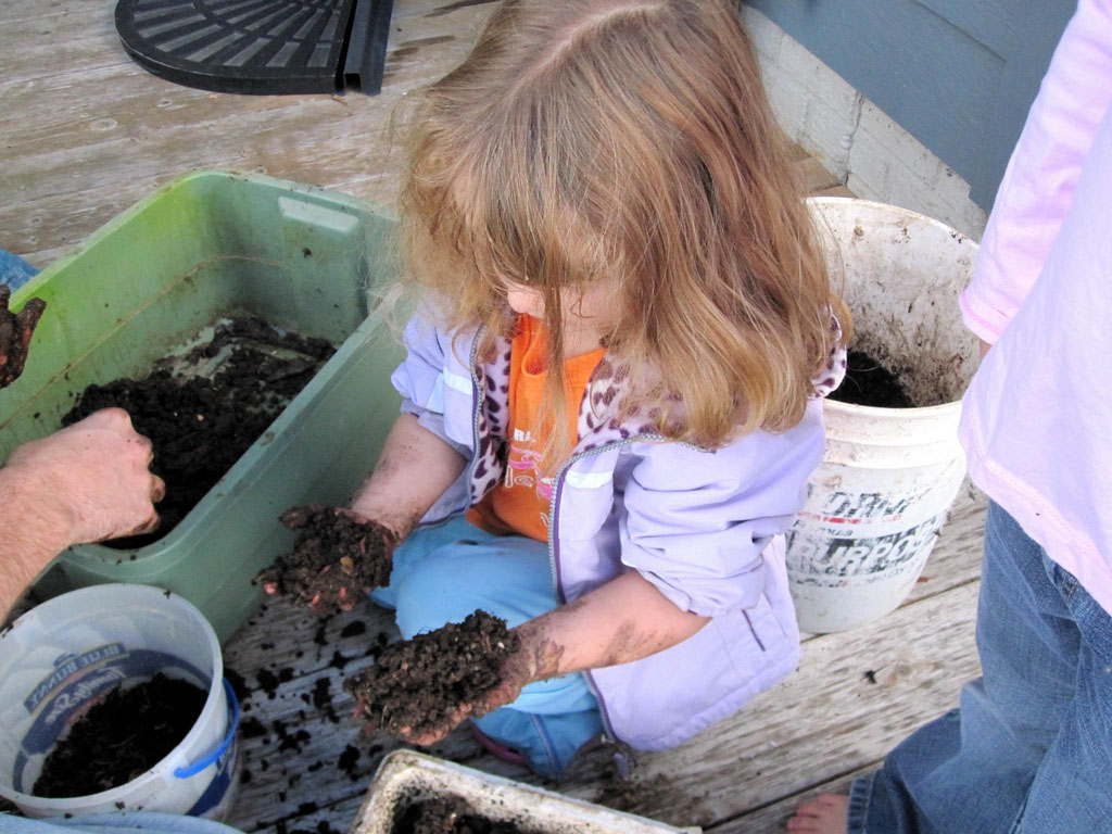 girl sorting vermicompost