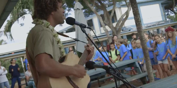 Jack Johnson plays music for kids at an elementary school in Hawaii as part of his Kokua Foundation work